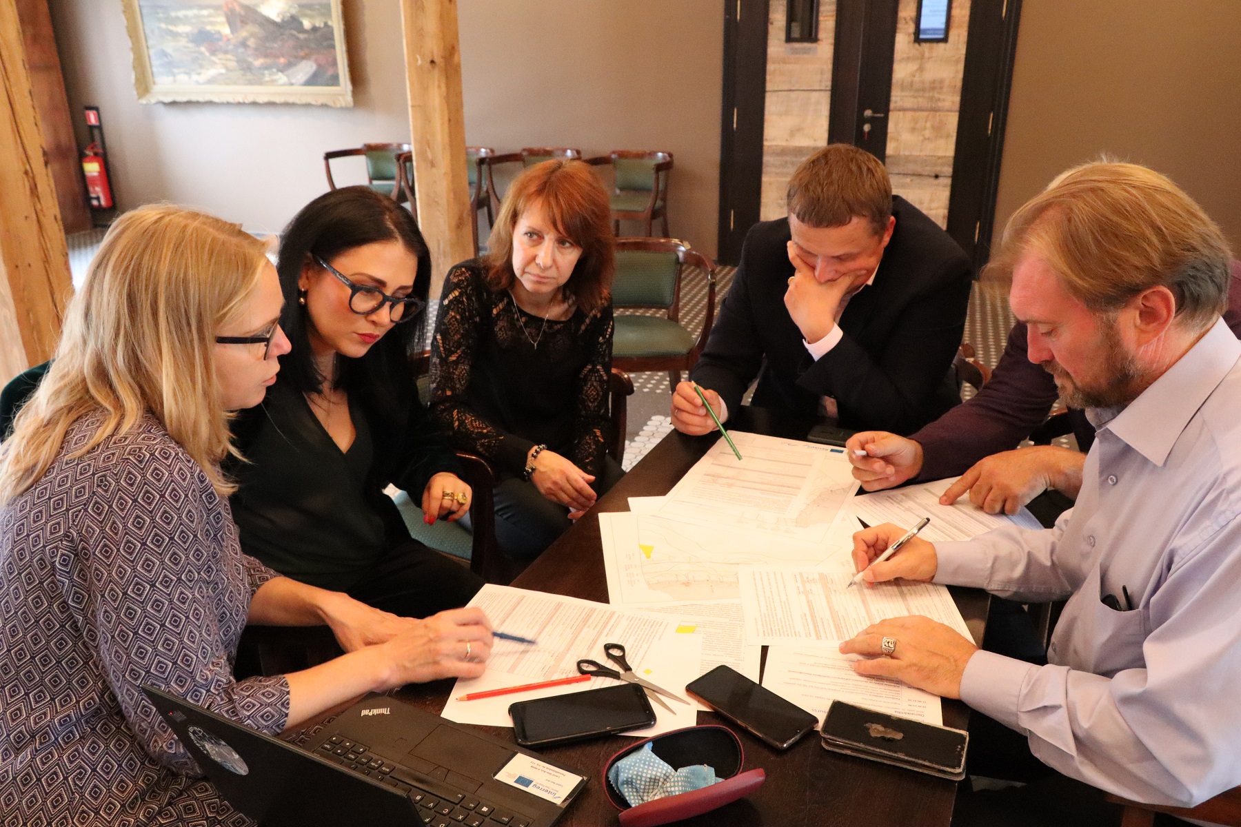 People by the table atv stakeholder seminar in Liepaja 2020